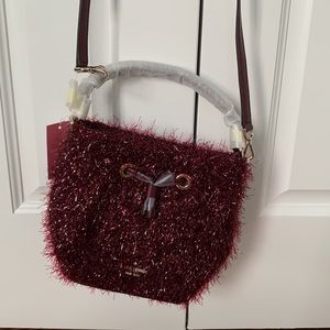 Kate Spade crossbody sparkly bag, burgundy; leather handle and cross body strap.